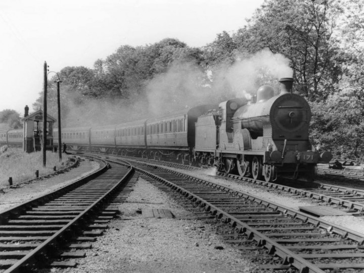 1950s: No.171 and train passing Omagh's North Cabin from the Strabane direction.