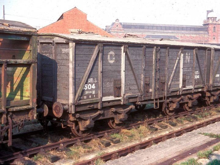 1965: Guinness Vans 504 and 2518 out of use in Maysfields yard. (D. Young)