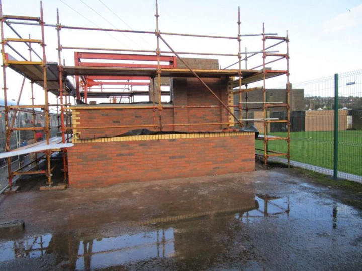 29/11/2015: The signal cabin brickwork matches the station building, seen from the Belfast side.