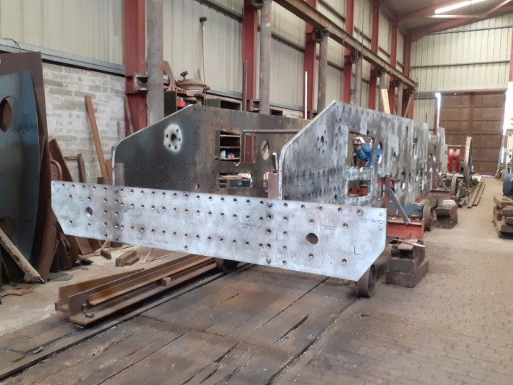 25/4/2021: Frames lifted into the upright position and placed on temporary stands on two works trolleys. The front buffer beam has also been attached, together with temporary cross ties to hold the frame in position. (P.A. Scott)
