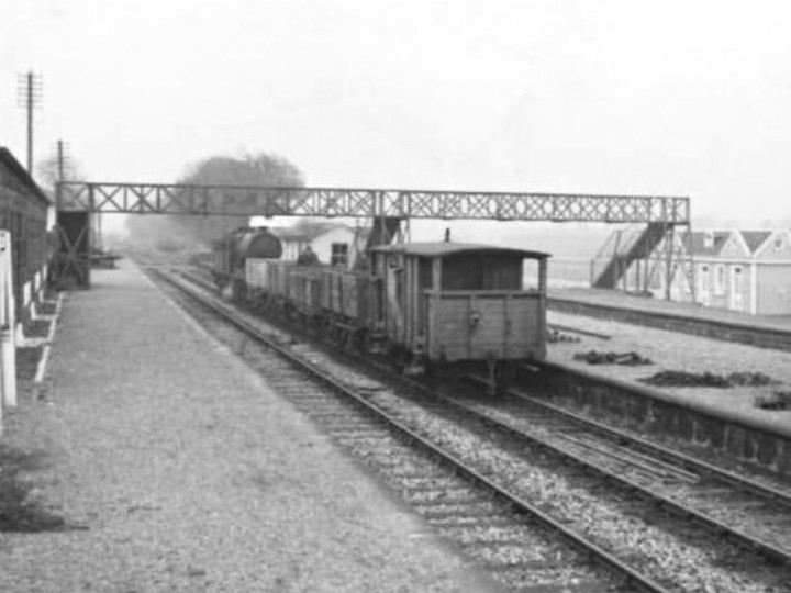 25/3/1960: No.461 on a lifted materials train at Foxrock station over a year after closure. (J.P. O'Dea)
