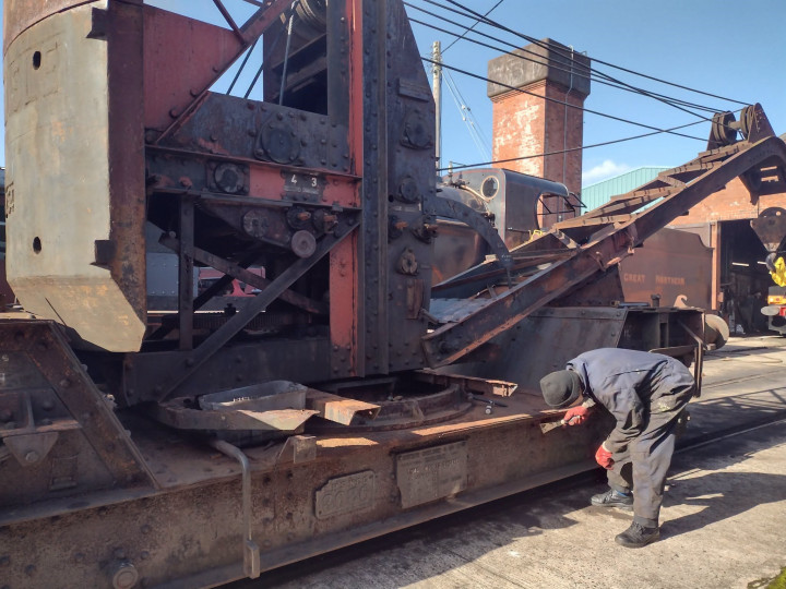 8/10/2026: The crane gets some much-needed attention as Joe Cassells attacks the rust.