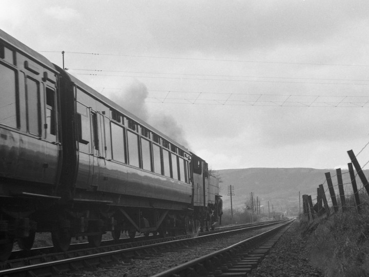 On Easter Tuesday 1970, the Larne line saw the last 'normal' steam passenger trains anywhere in the British Isles. 91 is seen here at the front of one of these trains, the 15:05 service from Carrickfergus to Belfast York Road, starting away from Clipperstown halt. (C.P. Friel)
